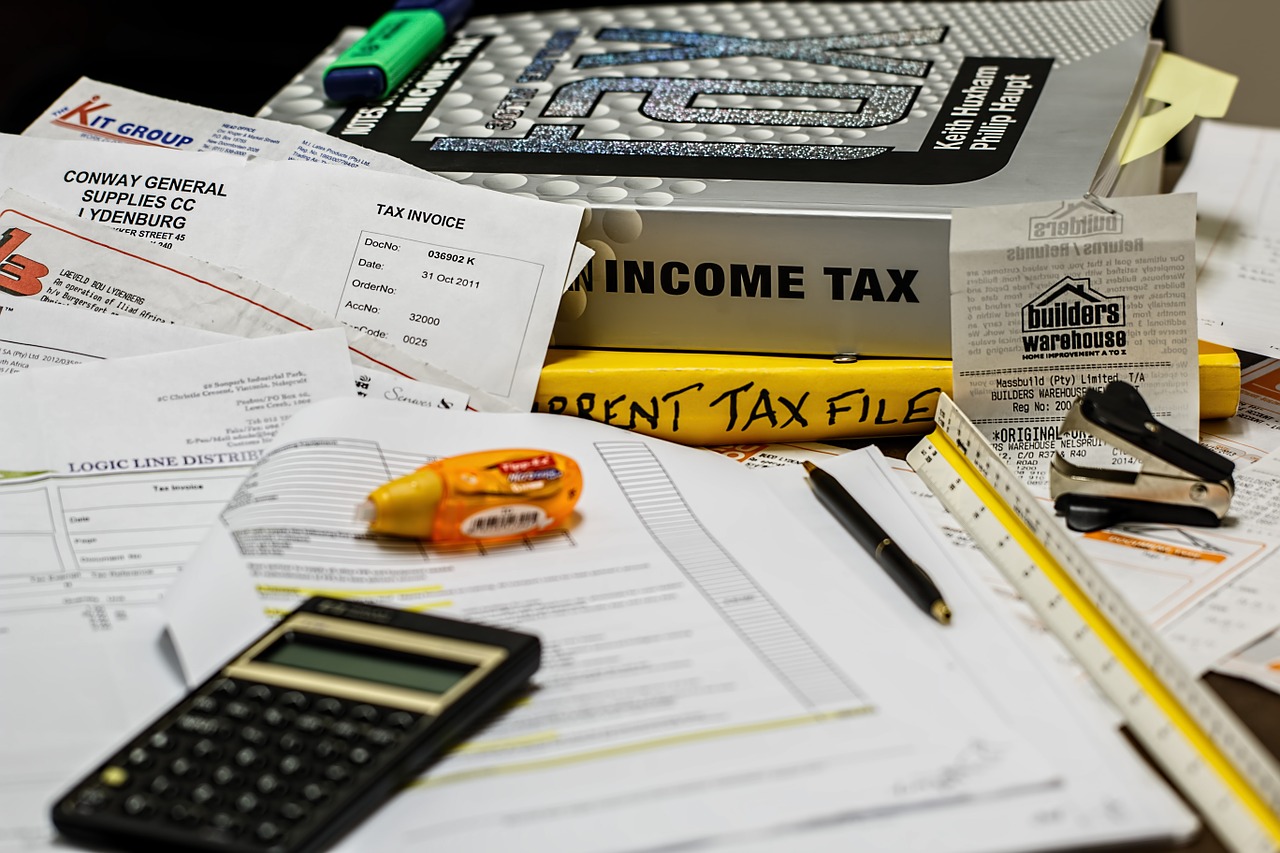 tax documents, tax books, calculator
