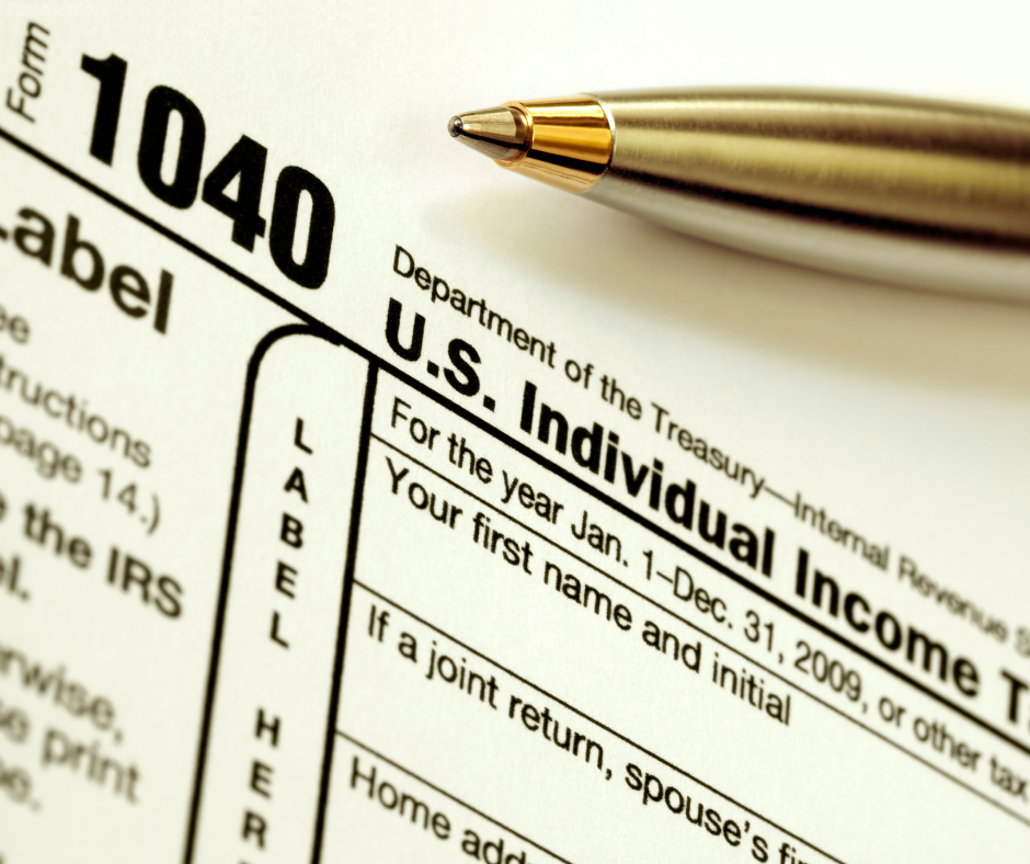 closeup of a 1040 tax form and pen